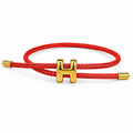 Pulsera ajustable con dije H de cordón trenzado color coral