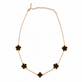 Collar de trébol dorado y negro
